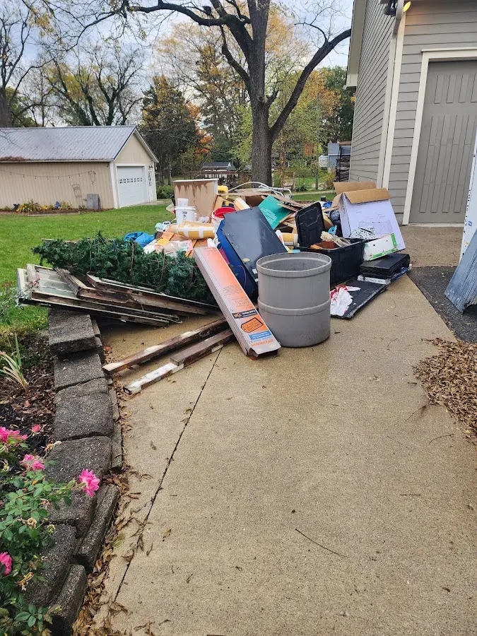 Dumpster being loaded with debris for 10 Yard Dumpster Rental in Swatara